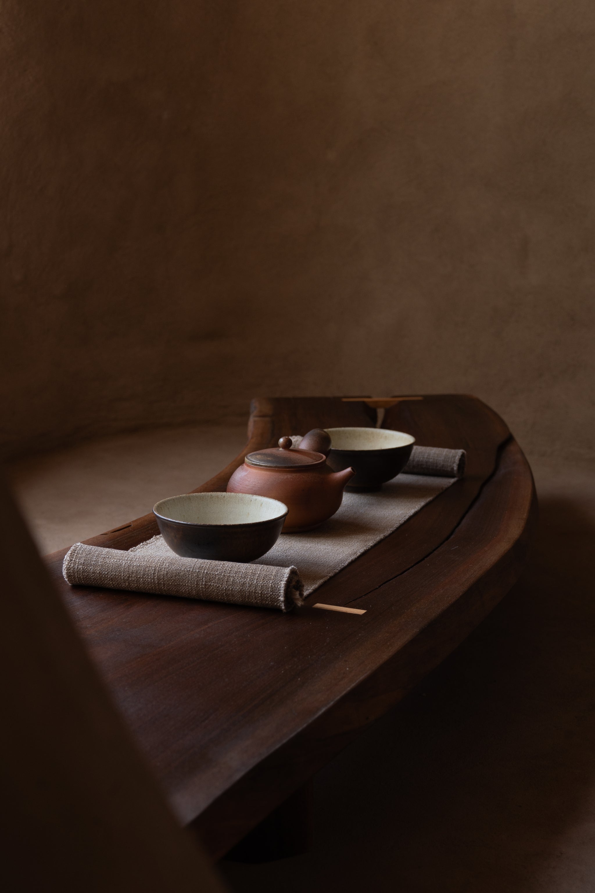 Curved live-edge walnut with oak joinery detail, Tea Table 02, Tea Table 02 with teacups and tea ceremony setup