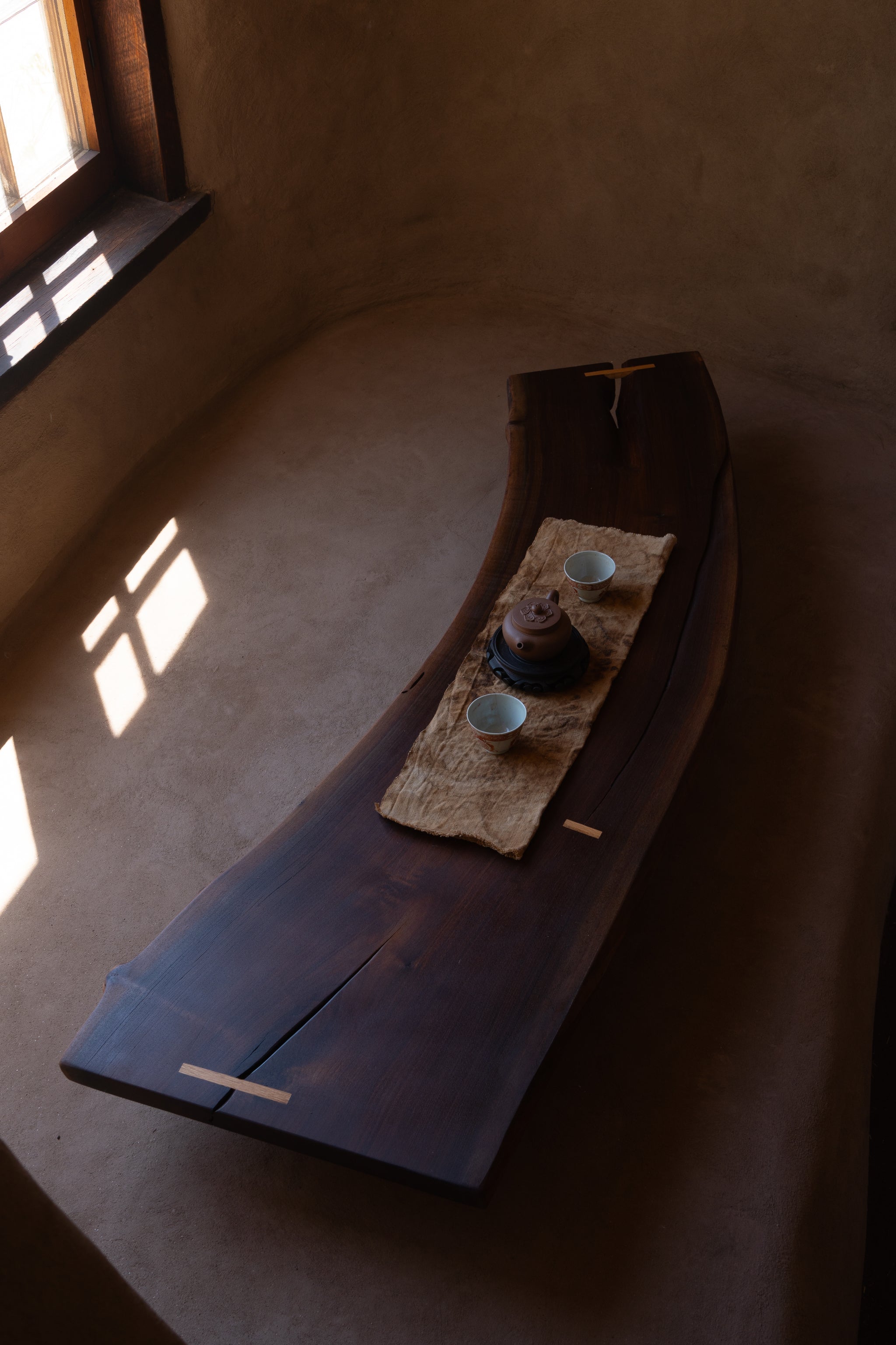 Curved live-edge walnut with oak joinery detail, Tea Table 02, Tea Table 02 with teacups and tea ceremony setup