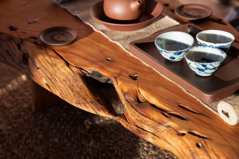 Tea set on a wooden table with a rustic background